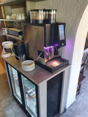 a counter with a coffee maker on top of it at Romantik Pension Lehrberg in Sankt Jakob in Haus