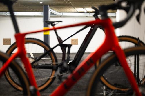 a red and black bike parked in a garage at 6532 Smart Hotel - Self check-in in Arbedo-Castione
