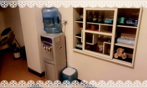 a toy refrigerator with a water jug on top of it at 富貴民宿Full Great B&B包棟名宿 in Changhua City