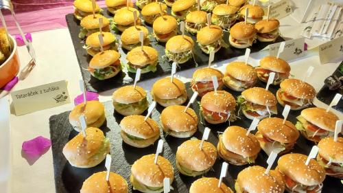a bunch of different types of hamburgers on a table at Hotel Ludmila in Mělník