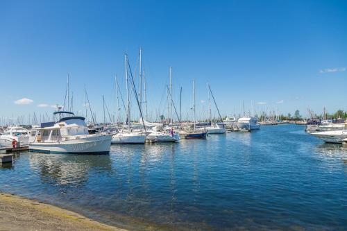 a bunch of boats are docked in a harbor at Beachhotel Cape Helius in Hellevoetsluis