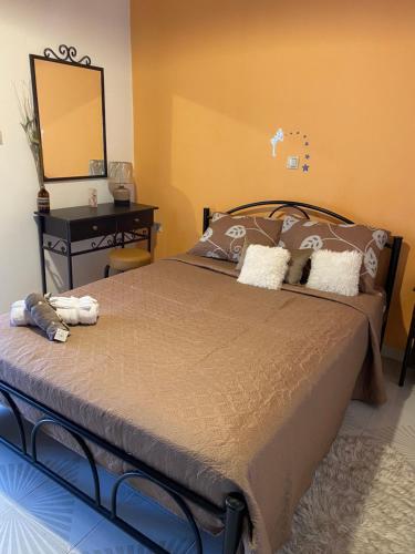 Postel nebo postele na pokoji v ubytování Spiros Place Corfu