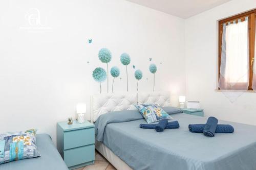 En eller flere senge i et værelse på Castelsardo Marina - Relax a 100 metri dal mare