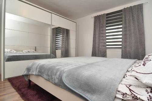 מיטה או מיטות בחדר ב-Apartman Gluić