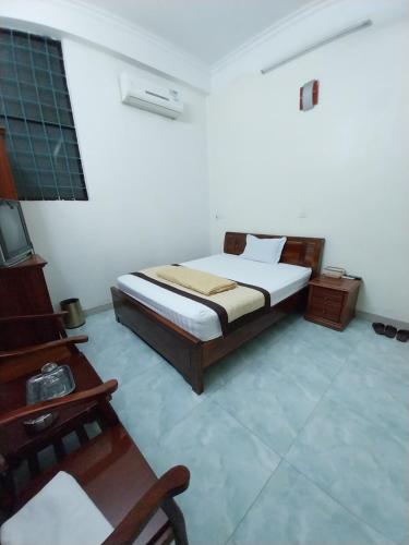 En eller flere senge i et værelse på Khách sạn Mi Sa
