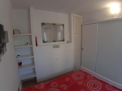 a room with a white door and a red carpet at Boni02 in Gdinj