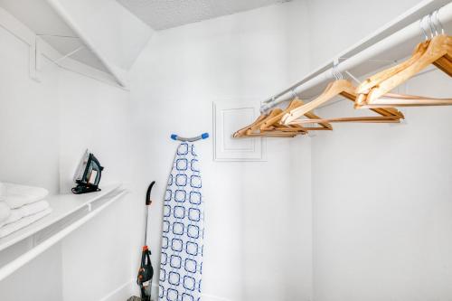 a room with white walls and a shelf with hangers at Redondo Beach 1BR w Pool Gym WD nr Beach LAX-615 in Redondo Beach