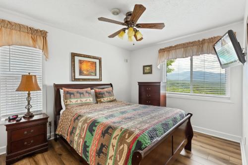 a bedroom with a bed and a ceiling fan at Deer Ridge Mountain Resort E208 in Gatlinburg