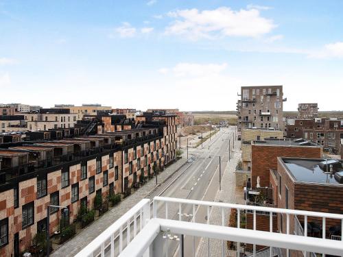 a view of a city from a balcony at Sanders Arena - Chic Three-Bedroom Apartment Close to Metro Station in Copenhagen