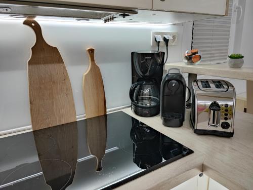 a kitchen with two wooden cutting boards on the counter at SEA LUX FLOATING HOUSE AJDA Portorose in Portorož