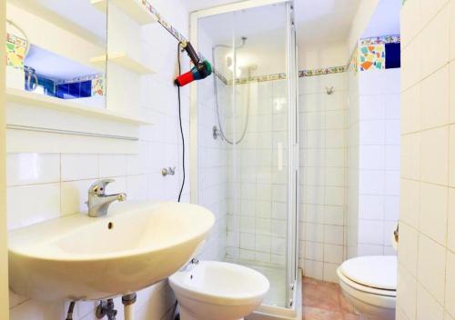 a bathroom with a sink and a shower at La Tata home in Salerno