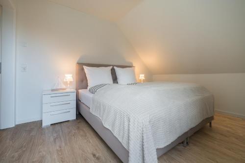 Postel nebo postele na pokoji v ubytování Ferienhaus Meerperle