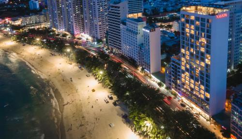 an aerial view of a city at night at Navada Beach Hotel in Nha Trang