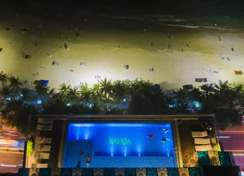 an aerial view of a swimming pool at night at Navada Beach Hotel in Nha Trang