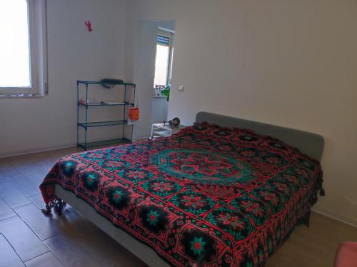 Tempat tidur dalam kamar di L'appartamentino