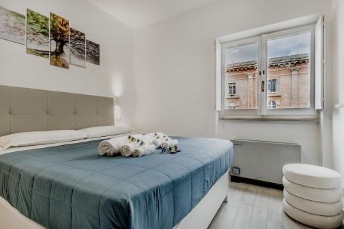 a bedroom with a bed with three stuffed animals on it at Frezza's Holidays in Rome
