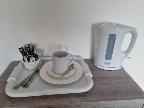 a tray with a coffee cup and a toaster at 70 Southfield in Middlesbrough