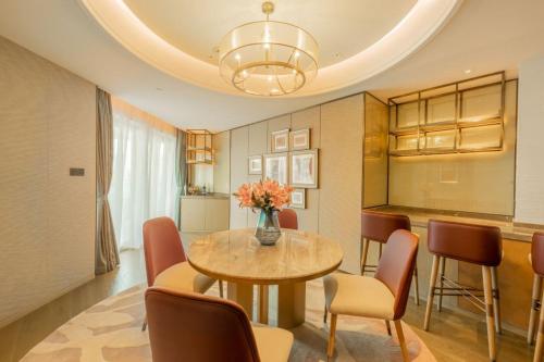 a dining room with a table and chairs at Blue Bay International Resort Hotel in Sihanoukville