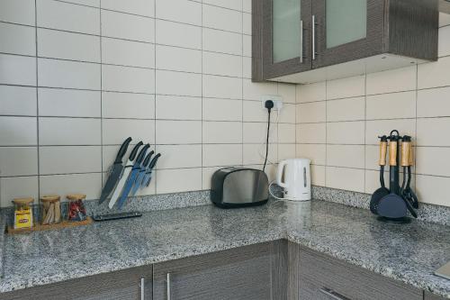 Η κουζίνα ή μικρή κουζίνα στο The Avery Apartments, Dzorwulu