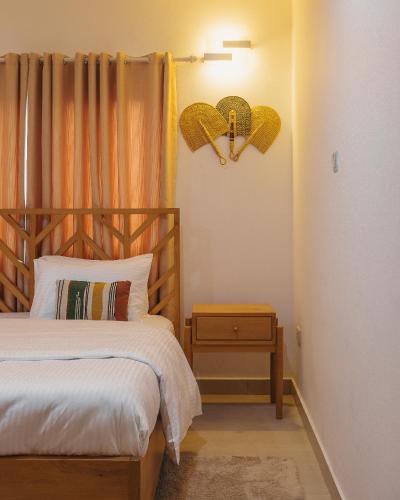 Ένα ή περισσότερα κρεβάτια σε δωμάτιο στο The Avery Apartments, Dzorwulu