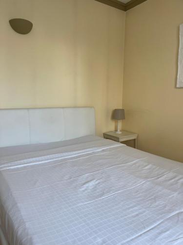 Cama o camas de una habitación en Appart Hotel Avril de la Roche