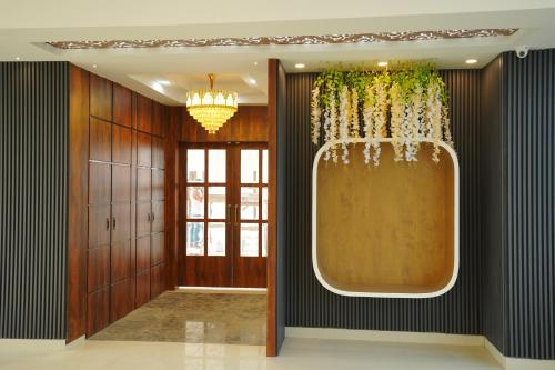 a hallway with a large window in a building at Hotel Royal Palace in Guwahati