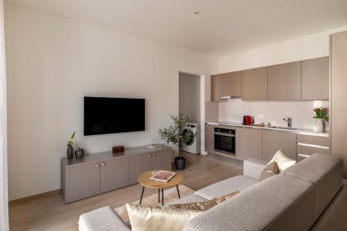 a living room with a couch and a table at Lugano Superior Suites - Free Parking in Lugano