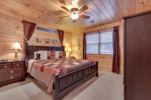 a bedroom with a bed and a ceiling fan at A Garden Blessing, 1 Bedroom, Hot Tub, Fireplace, Grill, WiFi, Sleeps 4 in Gatlinburg