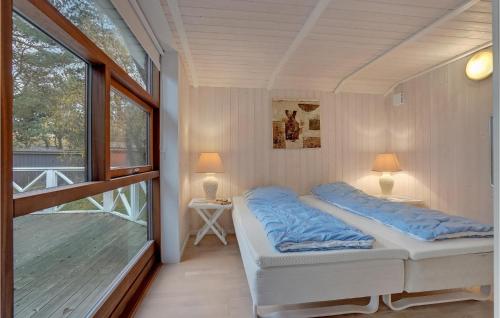 Кровать или кровати в номере Amazing Home In Rdby With 4 Bedrooms, Sauna And Wifi