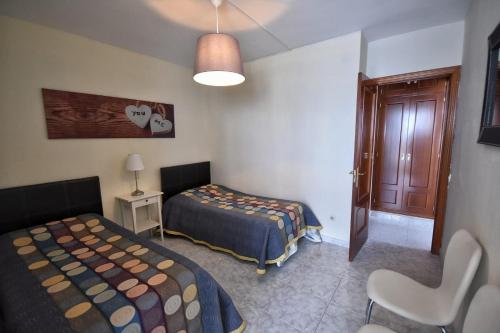 Postel nebo postele na pokoji v ubytování Gran Carihuela