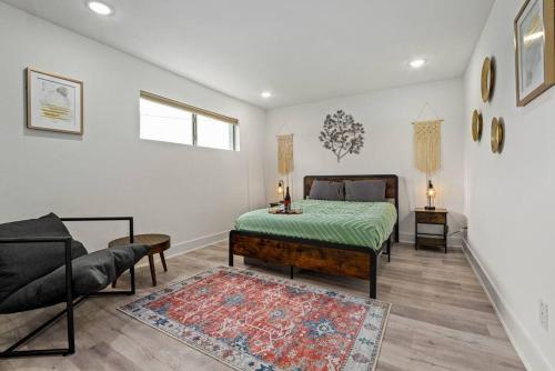 a bedroom with a bed and a couch at "A Home 4 All" X Lots of Goodies X Free Parking in Dallas