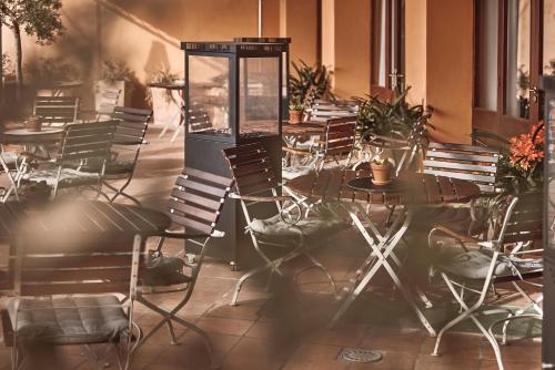 a group of chairs and tables in a restaurant at Maristel Hotel & Spa - Adults Only in Estellencs