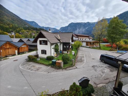 an aerial view of a house with a parking lot at B&B Hallstatt Lake - self check in in Obertraun