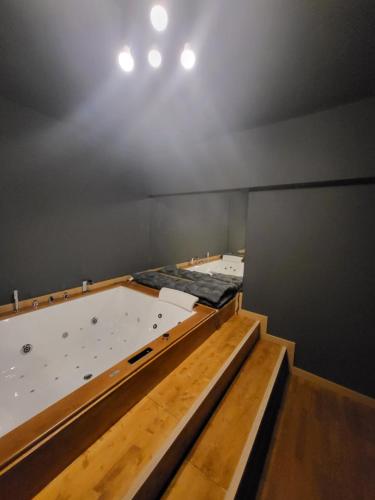 a room with two beds in a room with a ceiling at 50 SFUMATURE DI SUITE in Genova