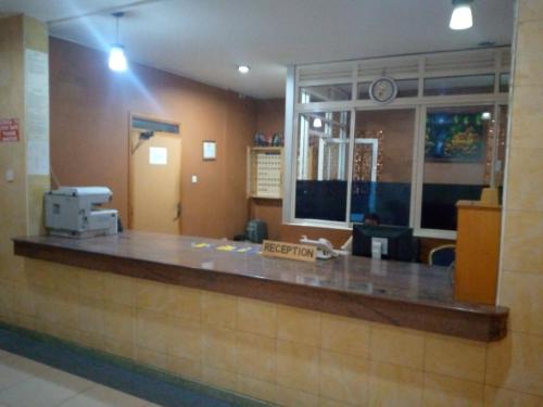 a waiting room with a reception counter in a hospital at DOUBLE FIVE HOTEL in Kampala