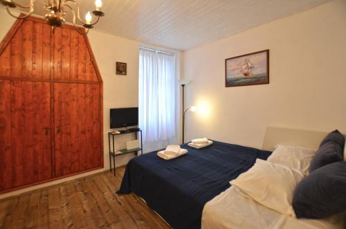 Postel nebo postele na pokoji v ubytování Nella Apartment