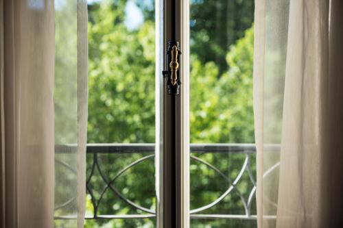 a close up of a window with a view at Maison Messmer - ein Mitglied der Hommage Luxury Hotels Collection in Baden-Baden