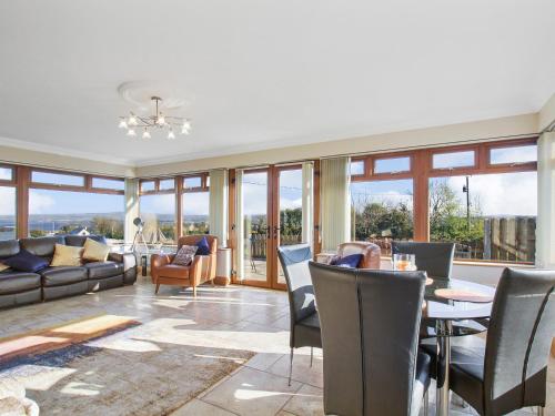 a living room with a table and chairs at Rose Cottage in Muff