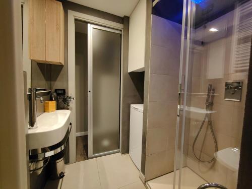 a bathroom with a shower and a sink at LuxOry Center - Brescia centro in Brescia