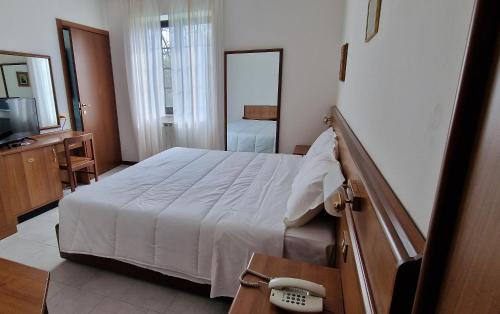 Postel nebo postele na pokoji v ubytování Hotel Montegrino Lakeview