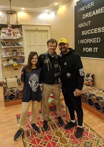 a group of three people posing for a picture in a store at Miami Hotel in Cairo