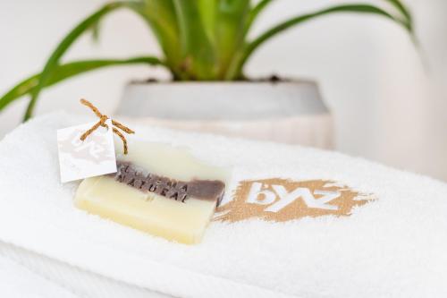 a bar of soap sitting on a table with a plant at Giritimu B'yaz in Selimiye