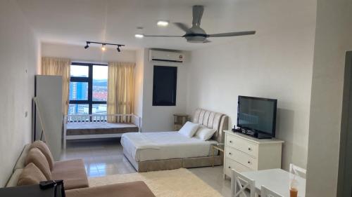 Ένα ή περισσότερα κρεβάτια σε δωμάτιο στο Homestay Bangi