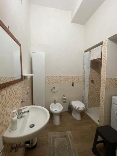 a bathroom with a sink and a toilet at TERRA MIA in Marsala
