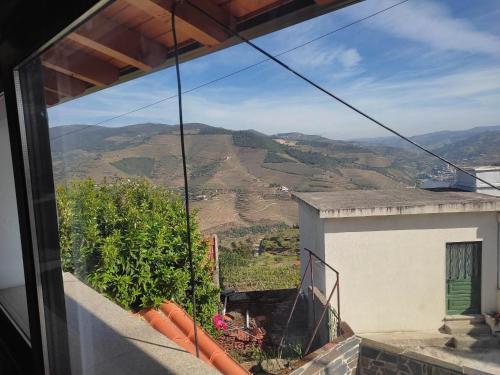 a view of the mountains from a balcony of a house at Petite Vista Douro in Valença do Douro