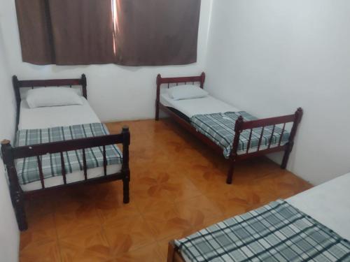 Una cama o camas en una habitación de Pousada 146