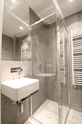 a bathroom with a sink and a shower at Elegant and Luxury Apartment @Altare della Patria in Rome