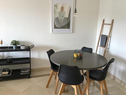 a dining room with a table and chairs at Casa Jilou in Mijas Costa