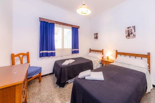 Ένα ή περισσότερα κρεβάτια σε δωμάτιο στο Villa Tixi