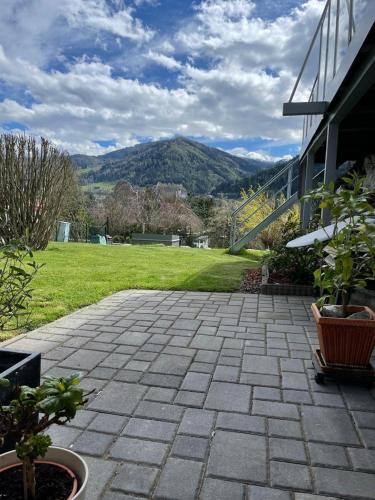 a brick patio with a view of a mountain at Jagdzimmer in Thalheim